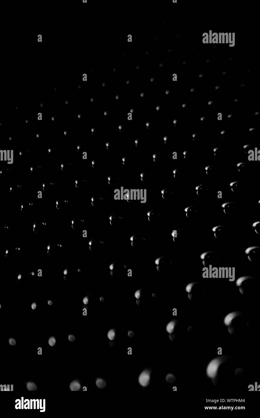 Seamless black studio background hires stock photography and images