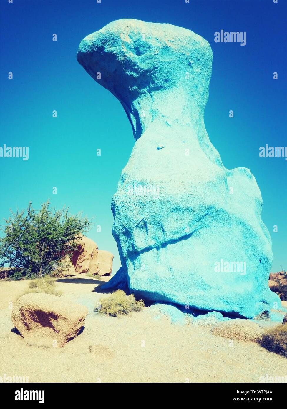 Large Blue Stone Against Clear Sky Stock Photo