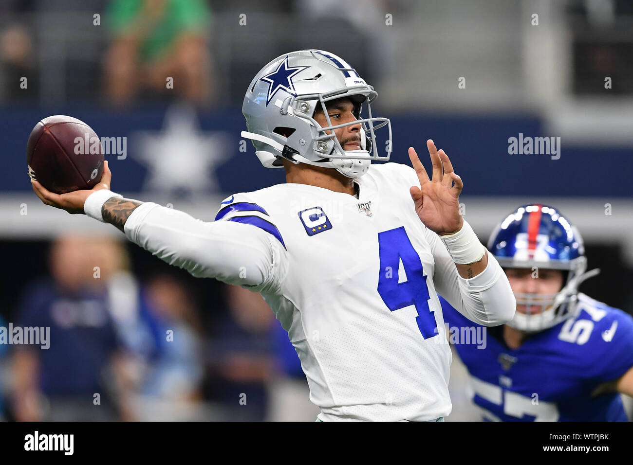 Arlington, Texas, USA. 8th Sep, 2019. Dallas Cowboys quarterback Dak Prescott (4) throws a touchdown pass to Dallas Cowboys wide receiver Randall Cobb (18) during the second half of the NFL football game between the New York Giants and the Dallas Cowboys at AT&T Stadium in Arlington, Texas. Shane Roper/Cal Sport Media/Alamy Live News Stock Photo