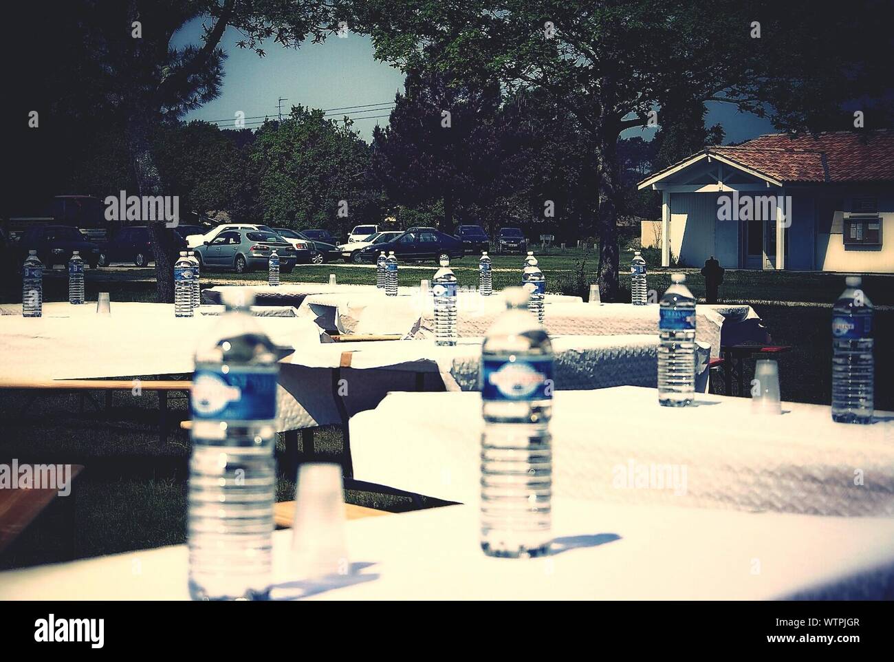 View Of Water Bottles On Outdoor Tables Stock Photo