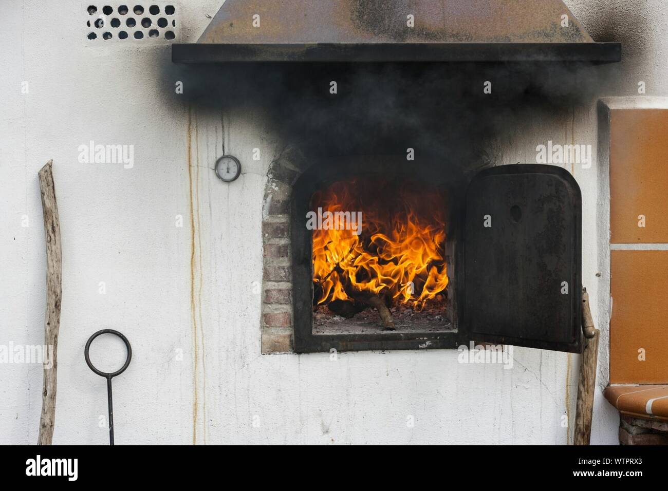 Smokes Coming Out From Wood Burning Stove Stock Photo Alamy