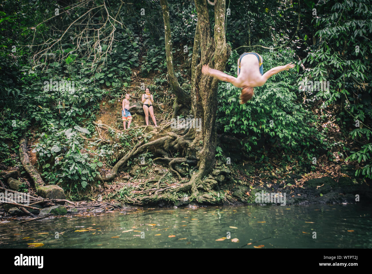 Friends jumping into river hi-res stock photography and images - Alamy