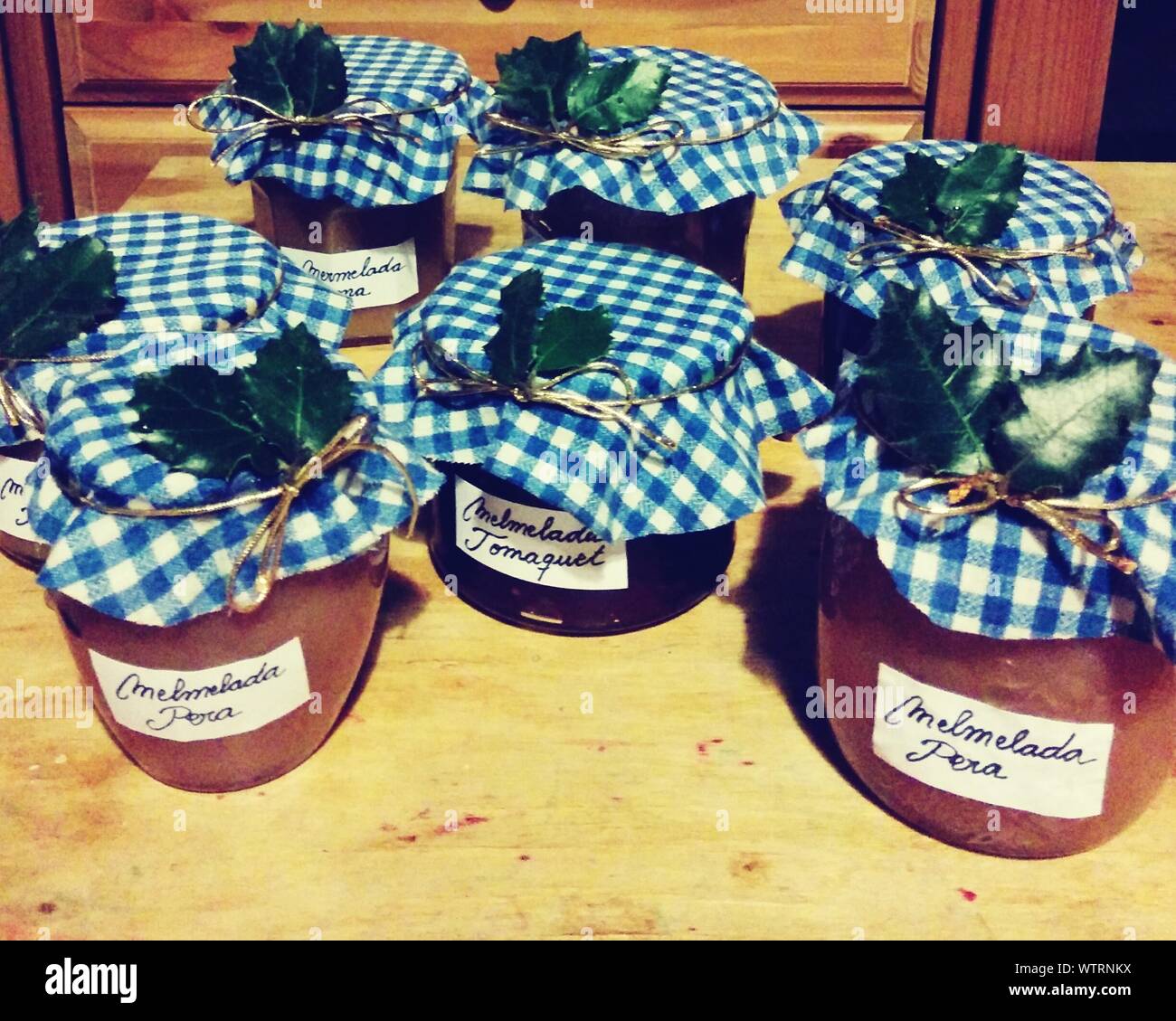 Homemade Jam Jars On Hardwood Floor Stock Photo Alamy