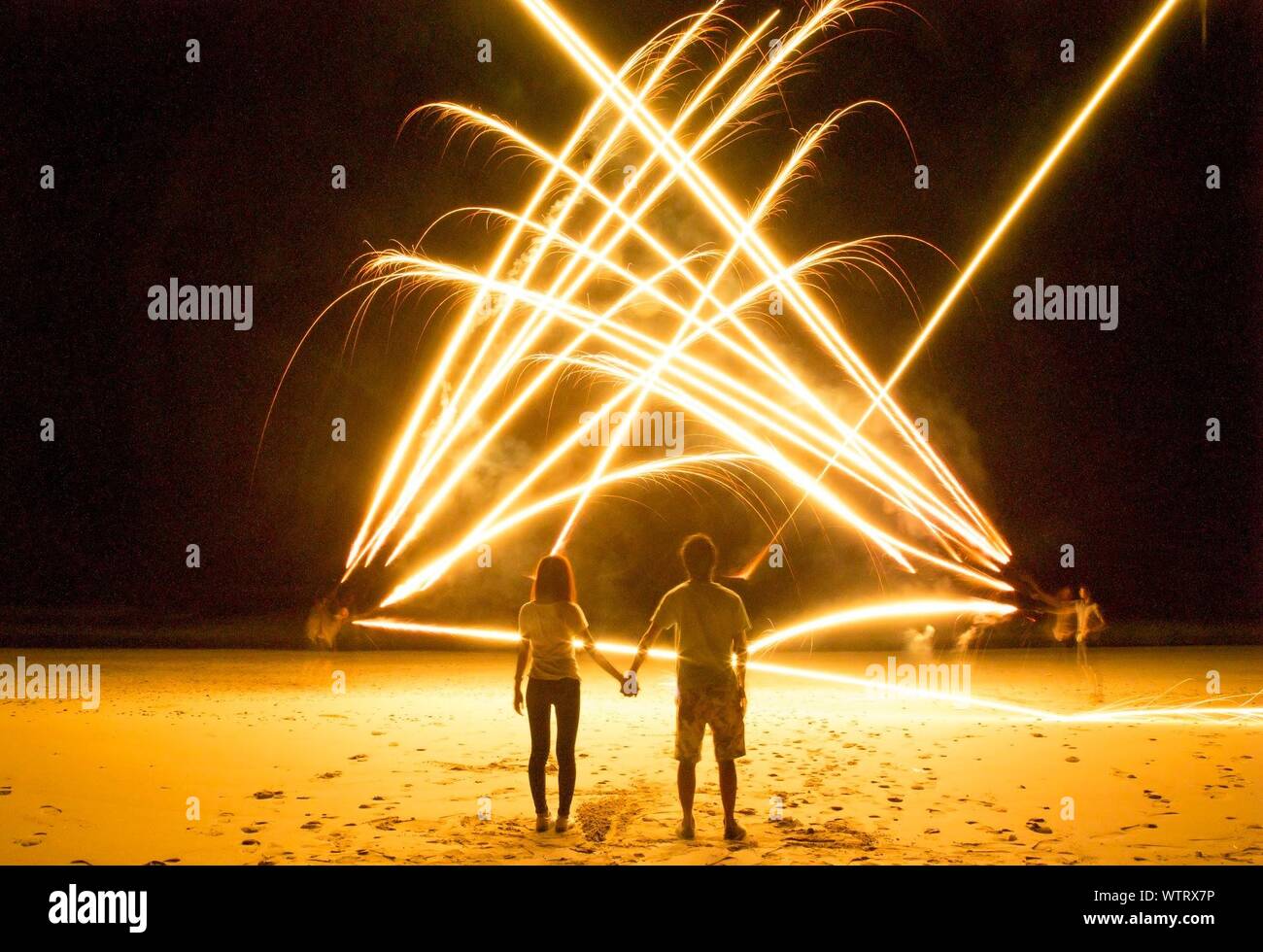 Man watching women on beach hi-res stock photography and images - Alamy