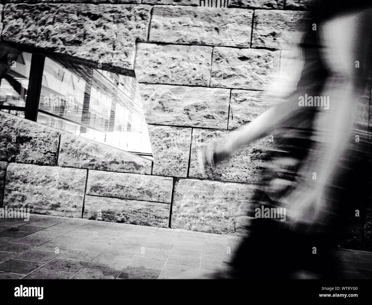 Person blurred walking by wall hi-res stock photography and images - Alamy
