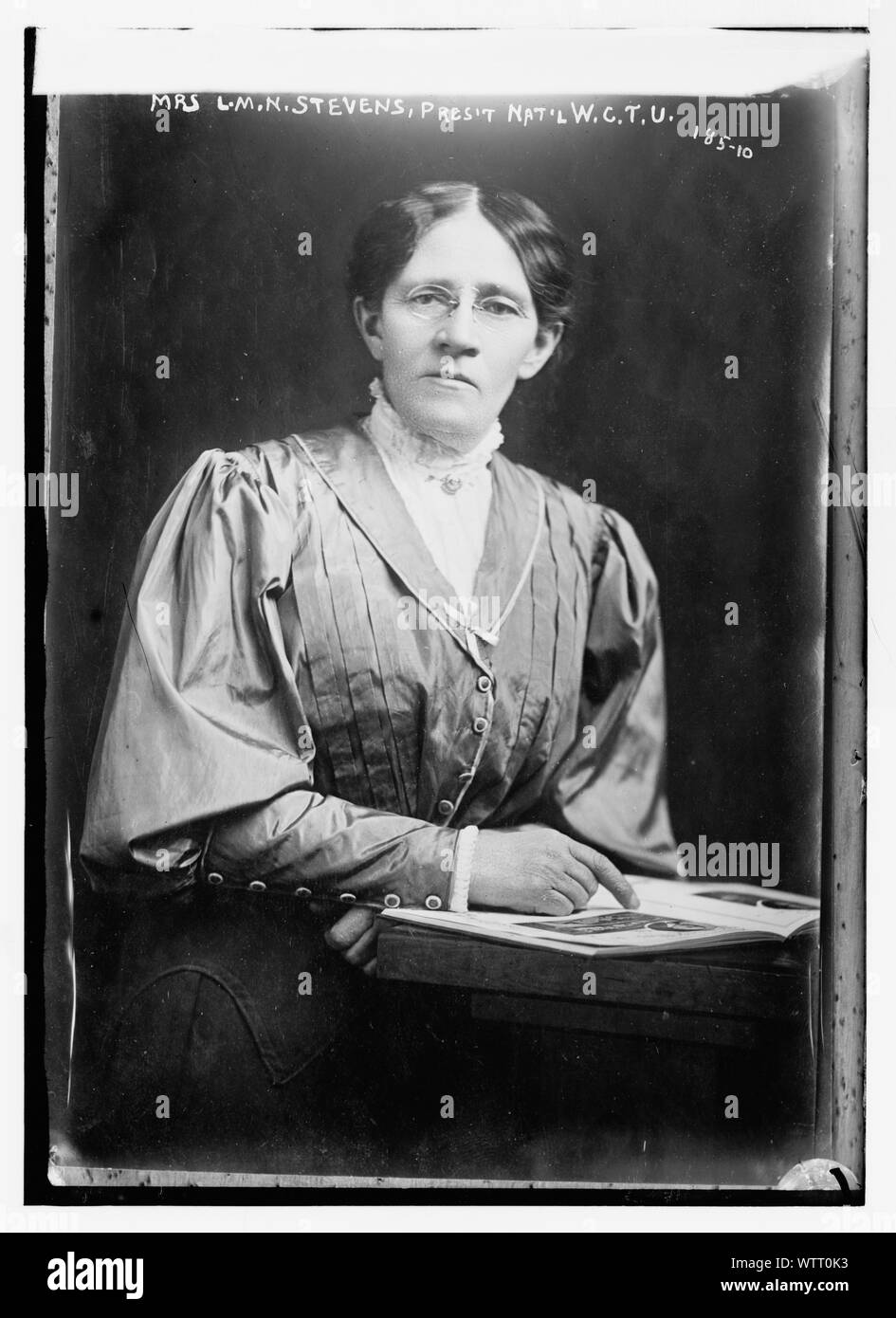 Mrs. L.M.N. Stevens, President of Nat'l W.C.T. U. seated with book Stock Photo