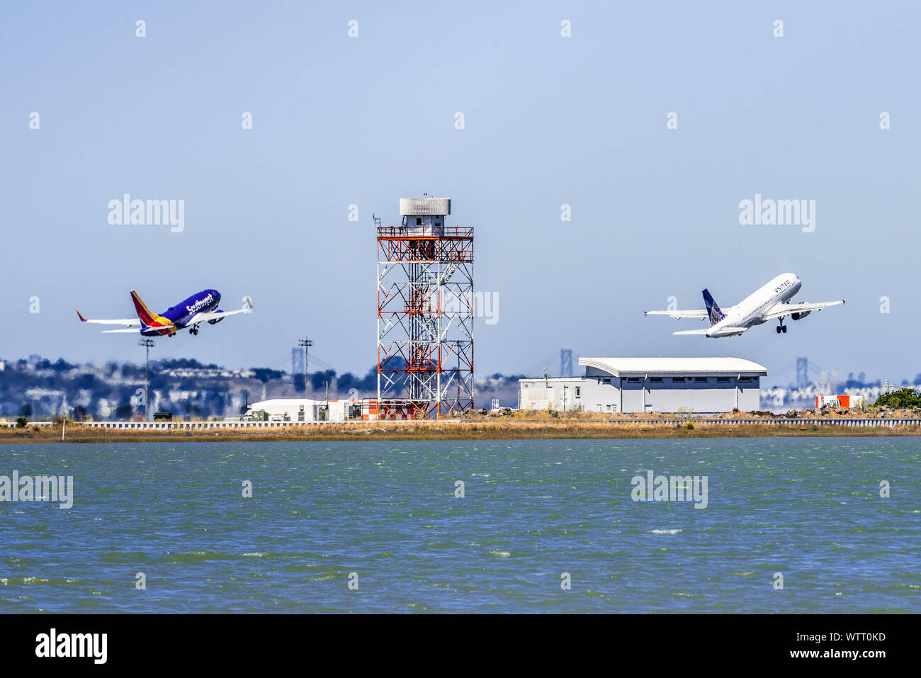 September 1, 2019 Burlingame / CA / USA - Two air crafts (Southwest Airlines and United Airlines) taking off at the same time from San Francisco Inter Stock Photo