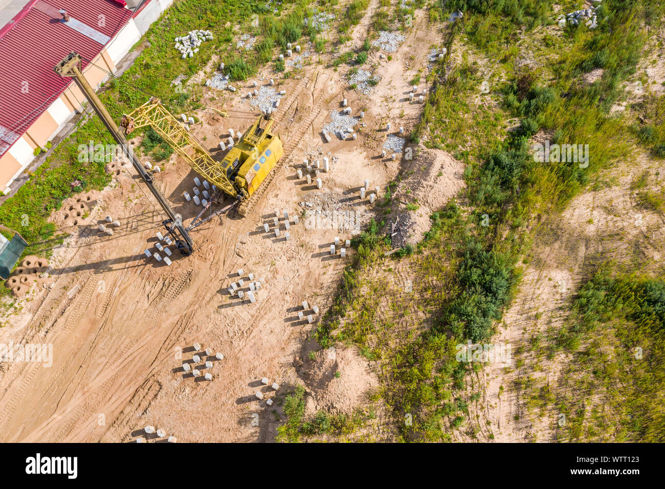 foundation pile driver machine. construction machinery on the construction site. aerial photo from flying drone Stock Photo