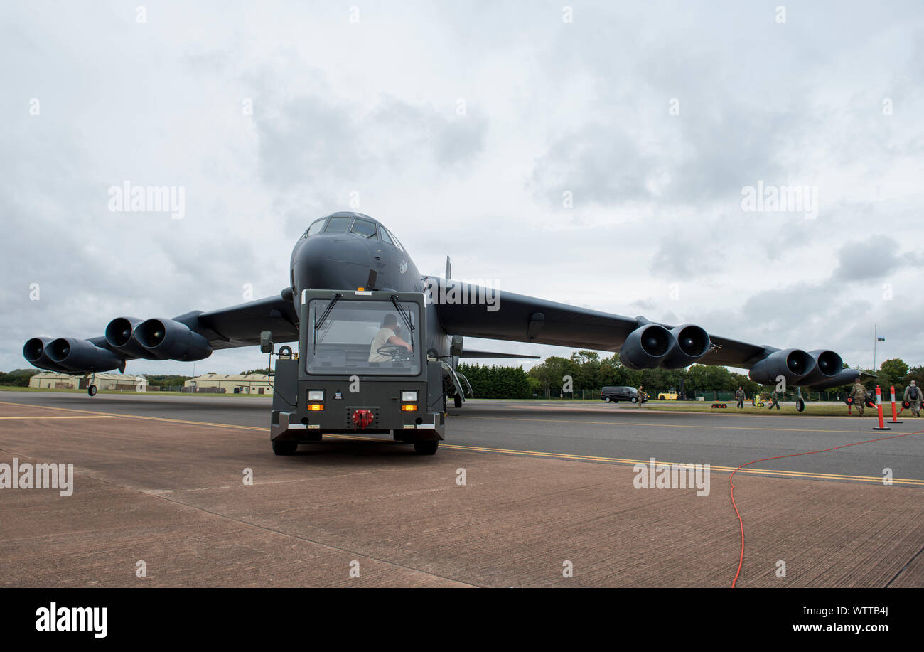A U.S. Air Force service member prepares to move the B-52 Stratofortress on display at the RAF Fairford 75th Anniversary Heritage Day at RAF Fairford, England, September 6, 2019. RAF Fairford has been used by the U.S. Air Force nearly continuously since it was first built for D-Day operations in 1944, and its support over the years to the B-47, KC-10, KC-135, B-52, B-2, B-1 and others have enabled combat operations around the world. It has had pivotal involvement in Operations Desert Storm, Deliberate Force, Allied Force, Iraqi Freedom, and more. (U.S. Air Force photo by Airman 1st Class Jenni Stock Photo