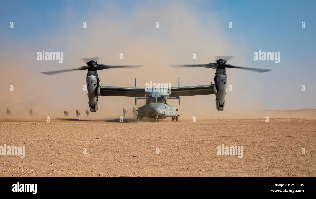 U.S. Marines with 1st Battalion, 7th Marine Regiment, attached to Special Purpose Marine Air-Ground Task Force-Crisis Response-Central Command, exit an MV-22 Osprey during a Tactical Recovery Aircraft and Personnel Exercise (TRAPEX) in Kuwait, Sept. 8, 2019. The SPMAGTF-CR-CC is a quick reaction force, prepared to deploy a variety of capabilities across the region. (U.S. Marine Corps photo by Sgt. Robert G. Gavaldon) Stock Photo