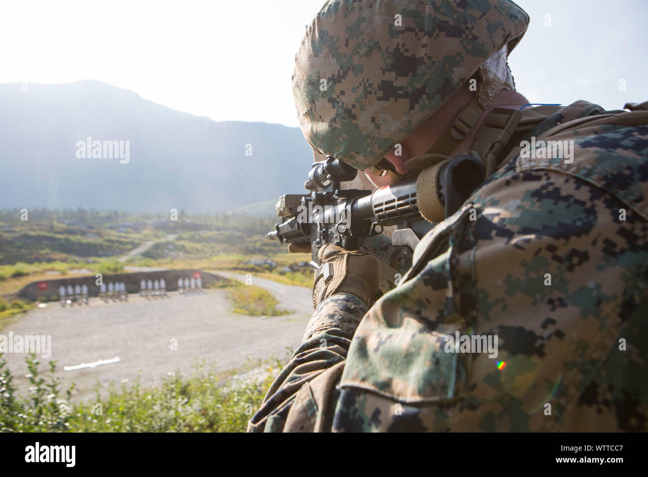 A U.S. Marine with Marine Rotational Force-Europe 19.2, Marine Forces Europe and Africa, fires an M4 carbine during a rifle range in Setermoen, Norway, Aug. 28, 2019. MRF-E focuses on regional engagement conducting various cold weather and mountain warfare training which enhances our overall interoperability with allies and partners. (U.S. Marine Corps photo by Lance Cpl. Larisa Chavez) Stock Photo