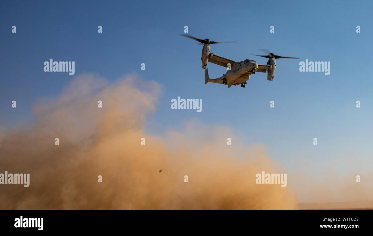 An MV-22 Osprey flown by U.S. Marines with Marine Medium Tiltrotor Squadron (VMM) 364, attached to Special Purpose Marine Air-Ground Task Force Crisis Response-Central Command, flies away during a Tactical Recovery Aircraft and Personnel Exercise (TRAPEX) at Kuwait on Sept. 8, 2019. The SPMAGTF-CR-CC is a quick reaction force, prepared to deploy a variety of capabilities across the region. (U.S. Marine Corps photo by Sgt. Robert G. Gavaldon) Stock Photo