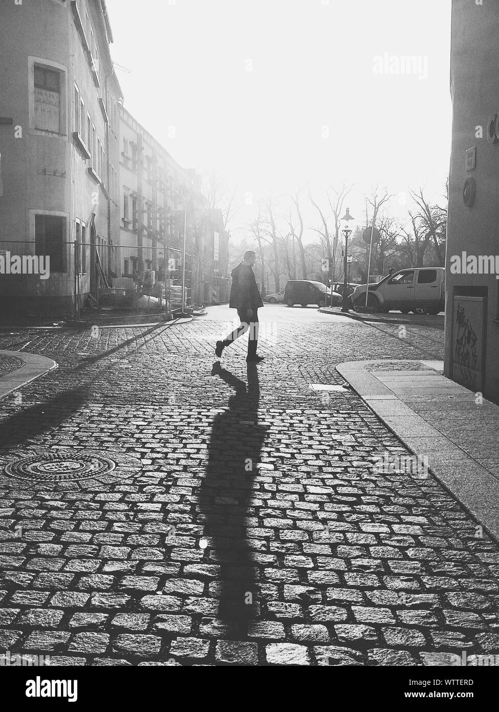 Man Walking Side View Sunlight Black and White Stock Photos & Images ...