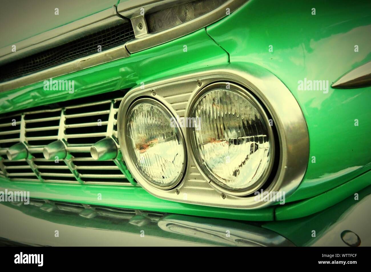 Headlight Of Green Car Stock Photo
