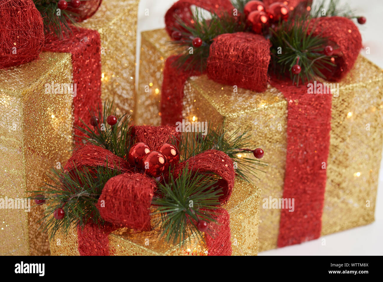 Gold christmas gift boxes with red color ribbons Stock Photo
