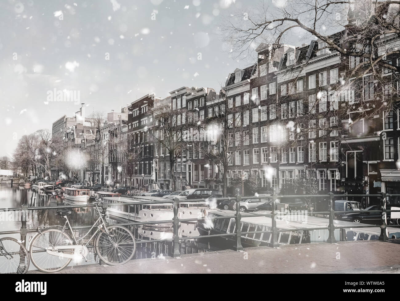 Amsterdam canals view at winter snowstorm. Pastel trendy toning ...