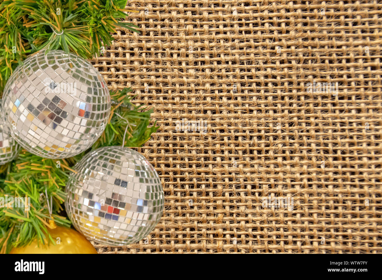 Glass ball ornaments on a Christmas tree Background Striped cloth with clipping path. Stock Photo