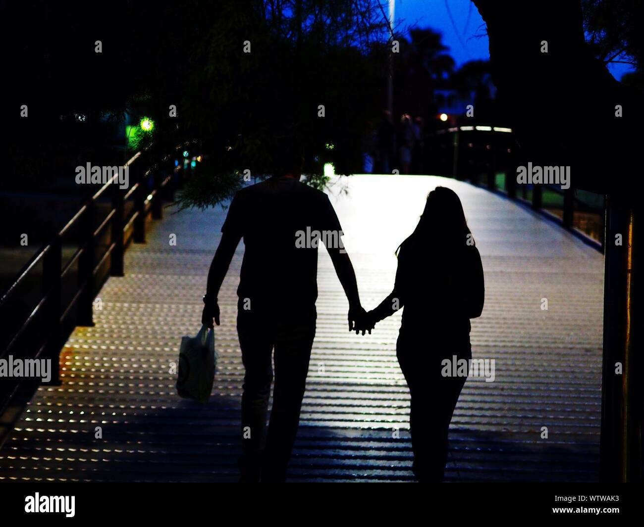 Couple Walking At Night High Resolution Stock Photography and Images