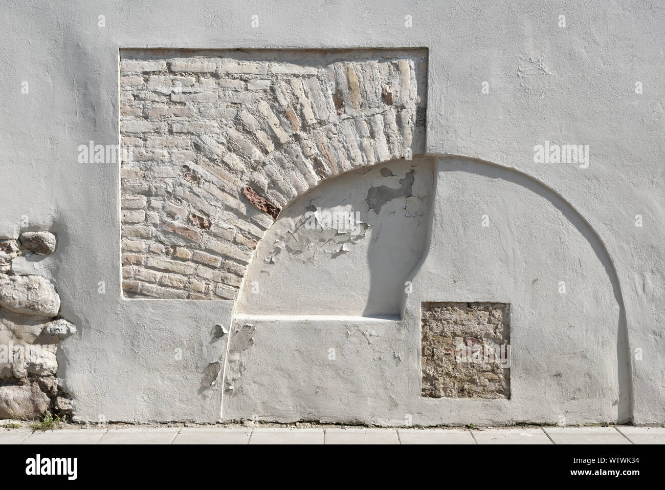 Ancient wall in Vilnius Old Town, on sunny day Stock Photo