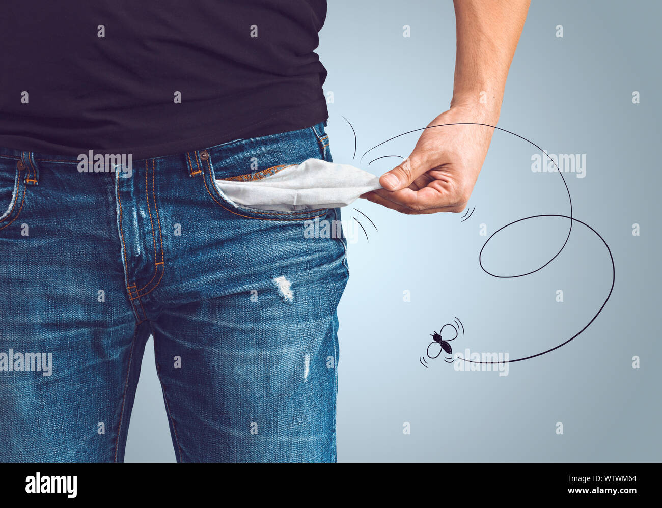 Poor man in jeans with empty pocket and drawn fly concept Stock Photo