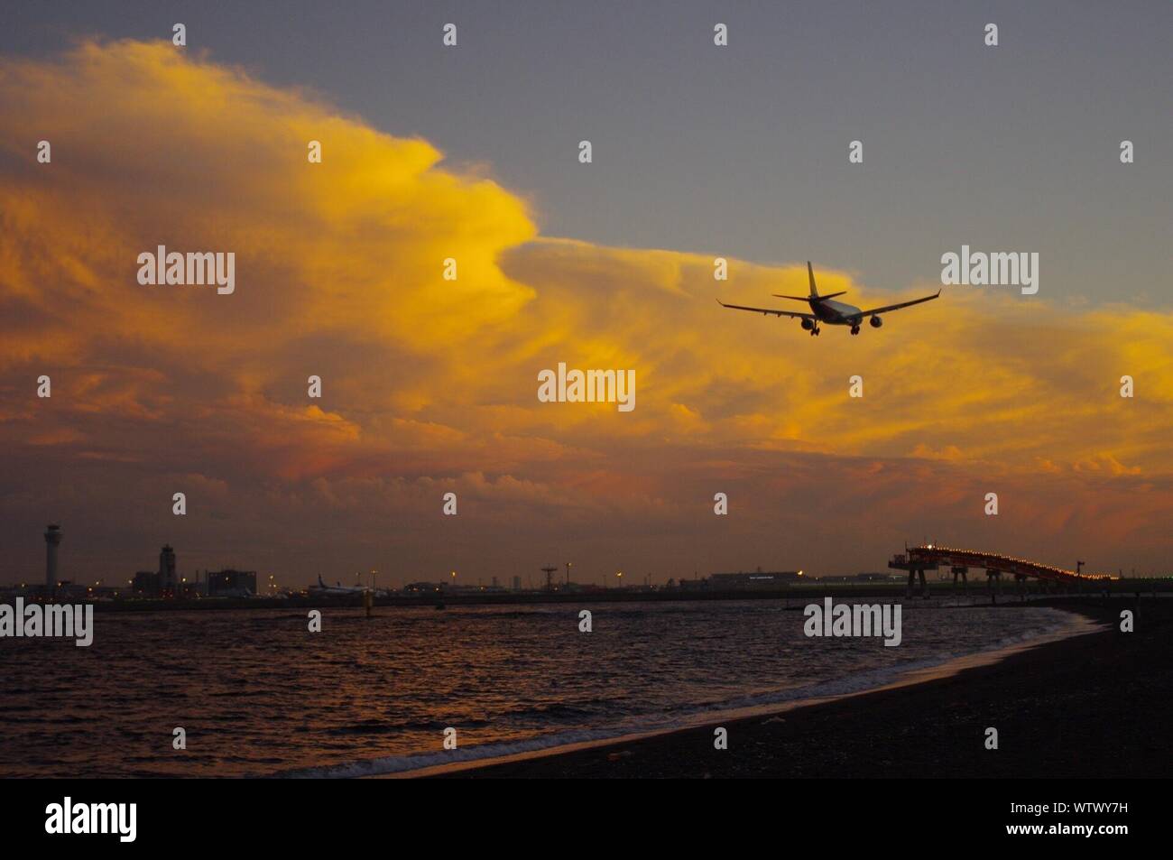 Airplane Flying Over Beach Stock Photos Airplane Flying Over