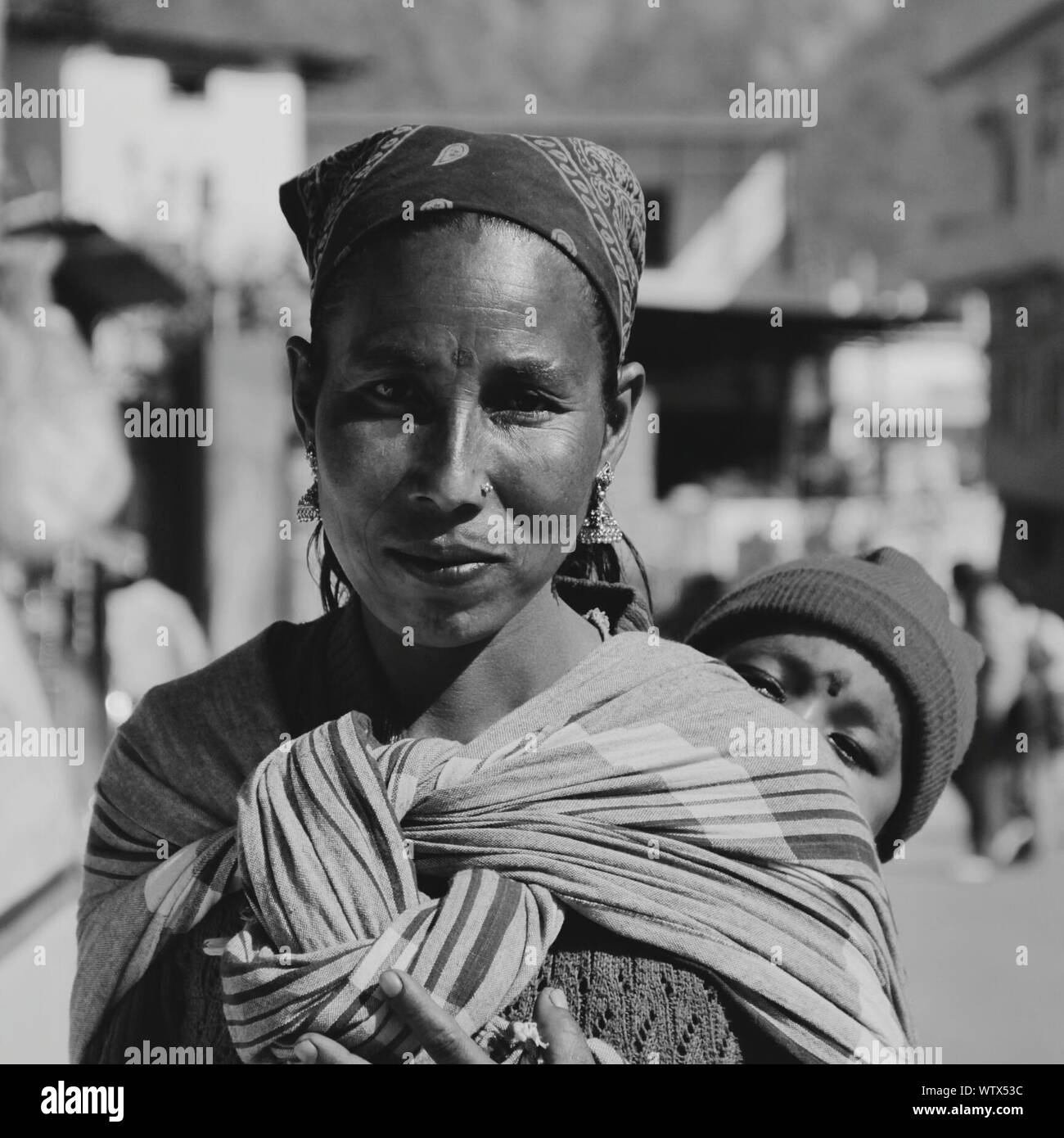 Indian woman carrying baby on hi-res stock photography and images - Alamy