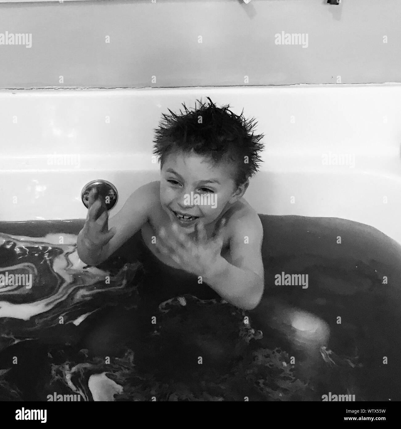 Happy boy taking a bath Black and White Stock Photos & Images Alamy