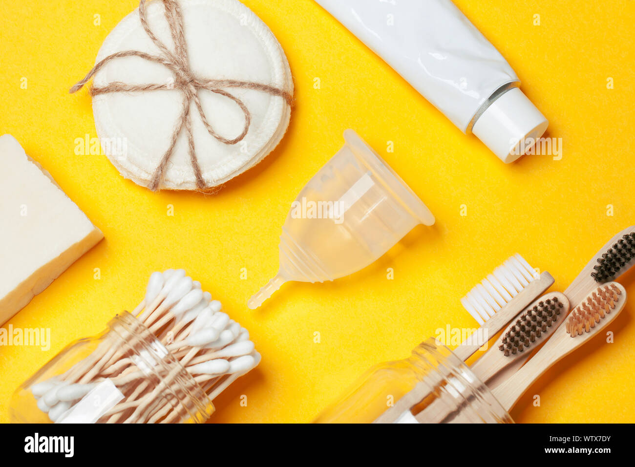 Set of eco-friendly plastic-free body care items on the yellow ...