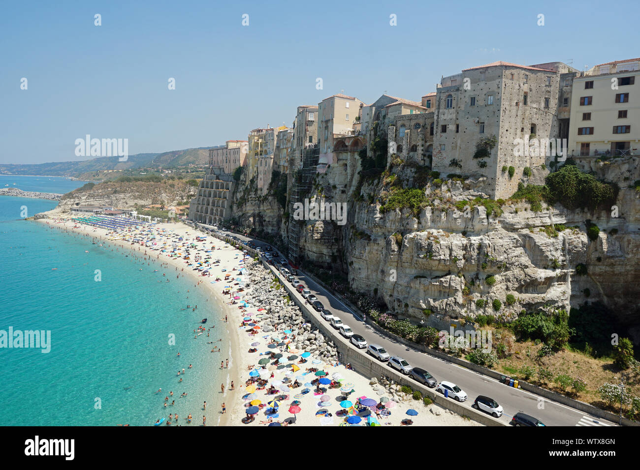 Tropea, Calabria, Italy public beach high scenic view from the south in august 2019. View of the beach and the town of Tropea built on the rocky shore Stock Photo