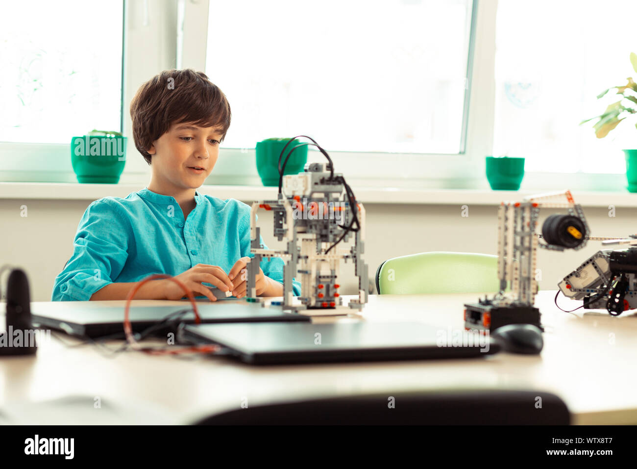 Pupil being in raptures at his school lesson. Stock Photo