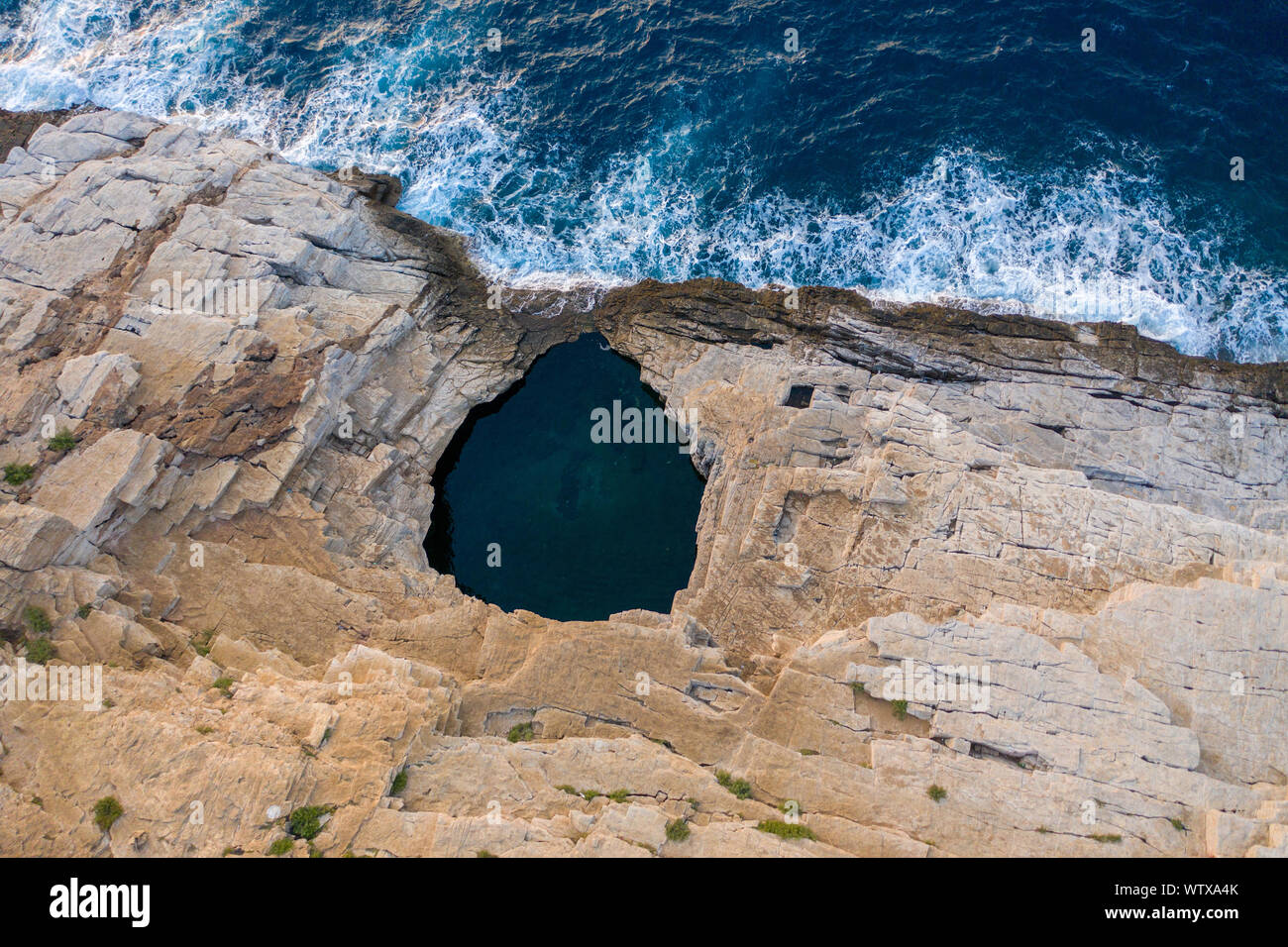 Aerial drone view of Giola lagoon, a natural seaside pool in Thassos ...