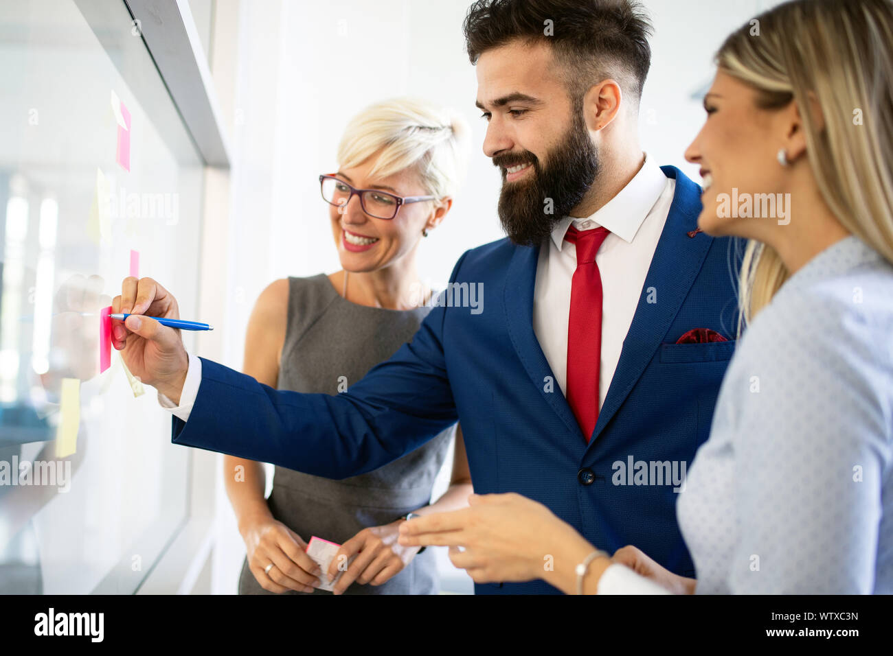Group of business people discussing, brainstorming in office ...