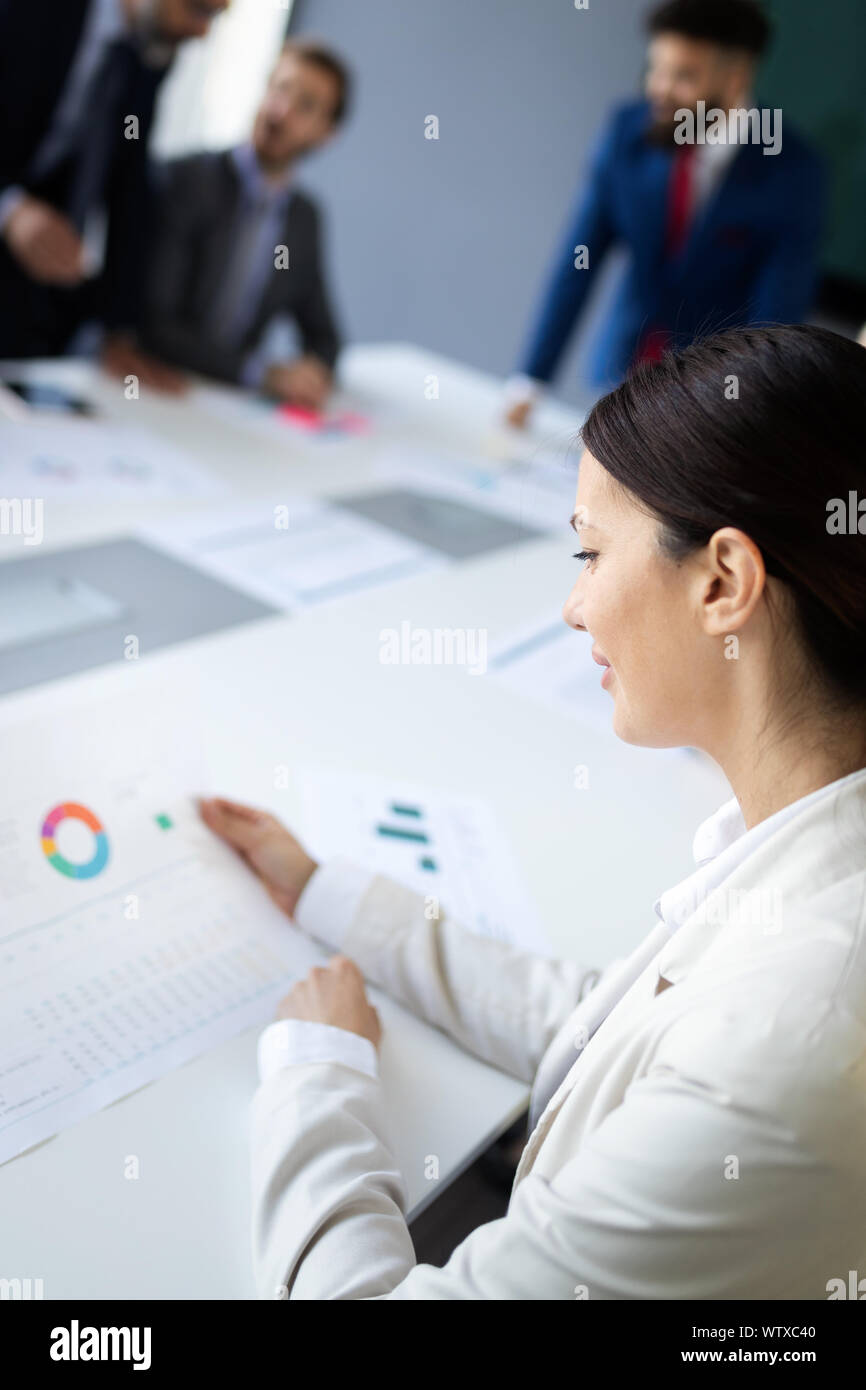 Group of business people discussing, brainstorming in office ...