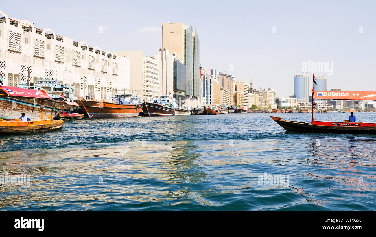 Dubai, United Arab Emirates - November 11, 2018:  View over Dubai Creek, water taxis are crossing over from one side of old Deira to the other side, i Stock Photo