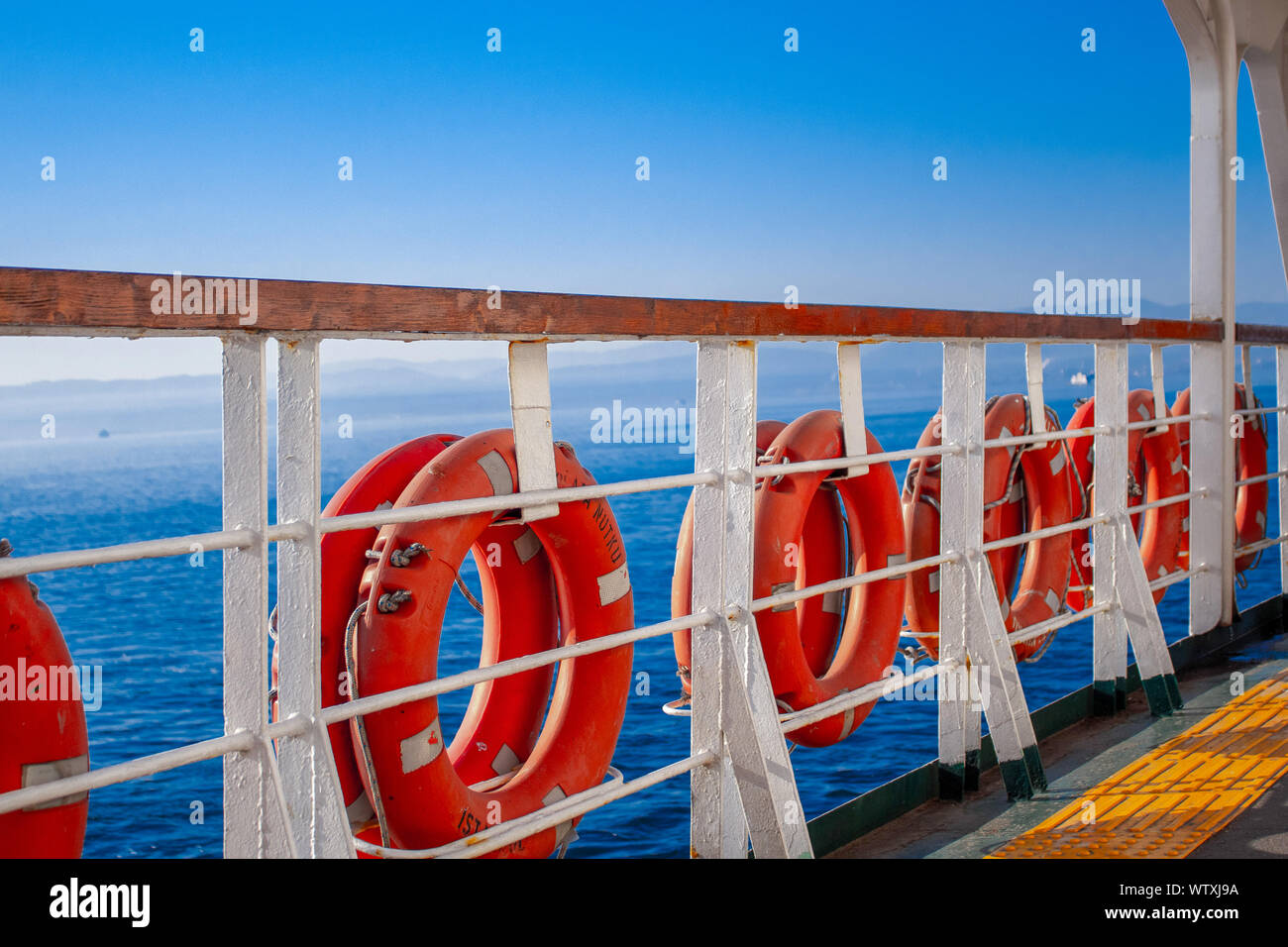 Ring lifebuoy on big boat. Obligatory ship equipment. Personal flotation device. Prevent