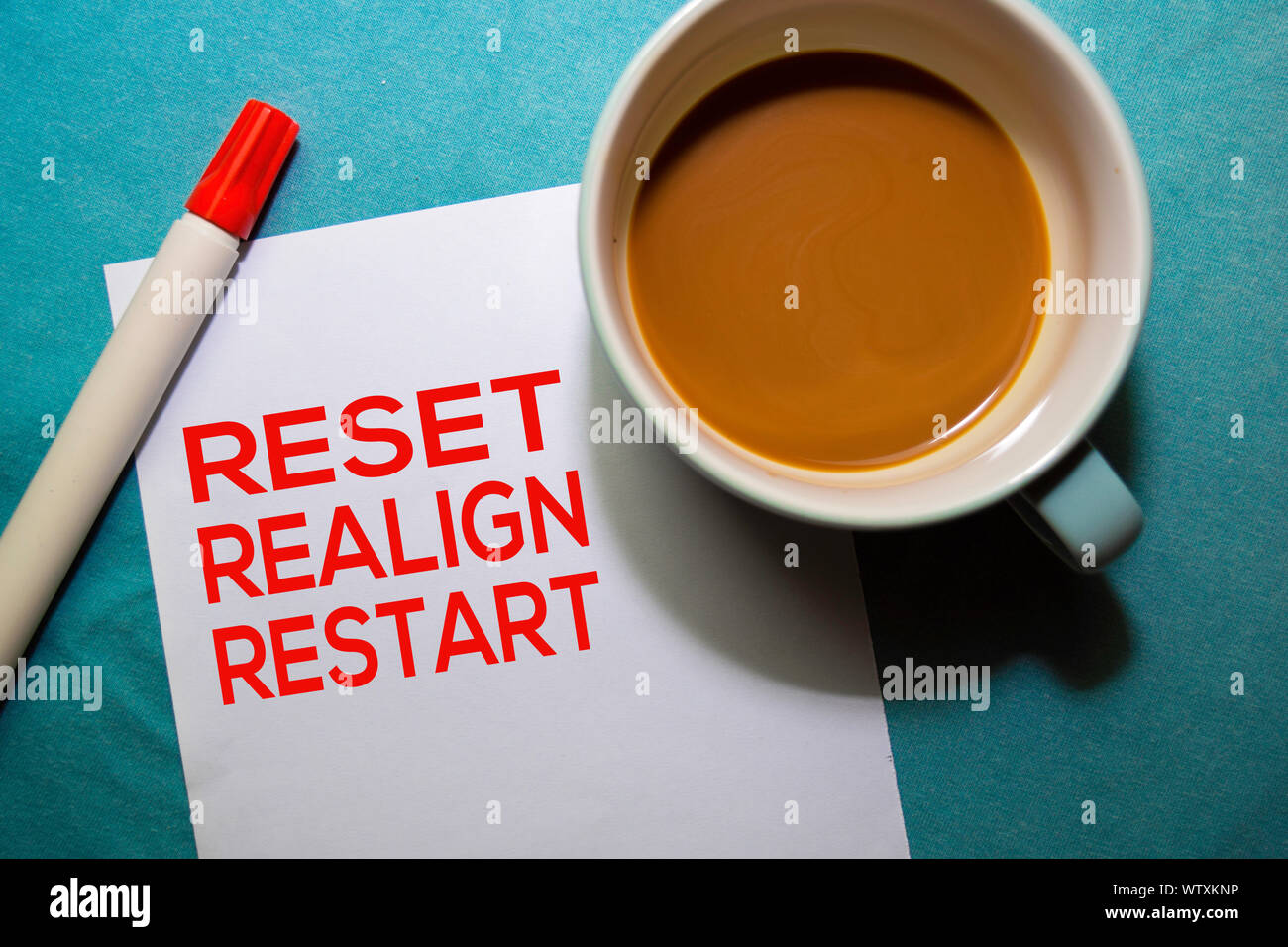 Reset Realign Restart text on the paper isolated on office desk ...