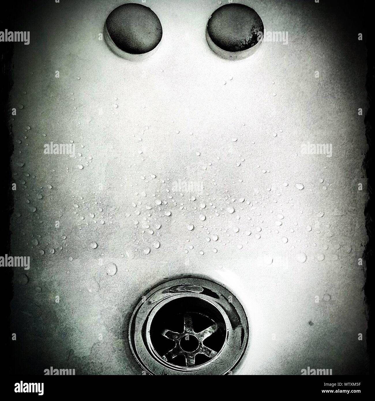 Close-up View Of Plughole Of Sink With Two Overflow Holes Stock Photo