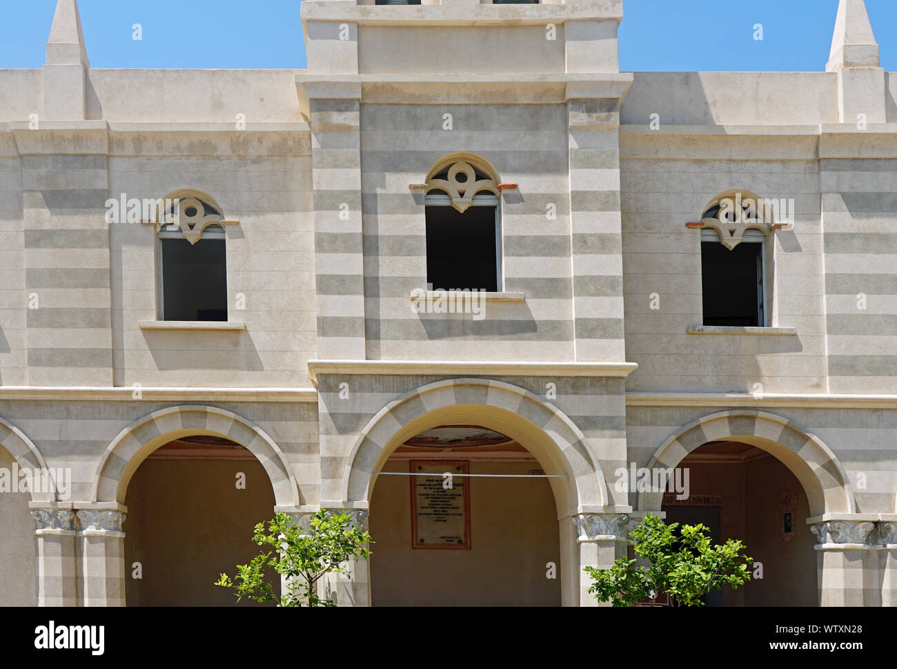 Close up of the windows of the church Santa Maria dell'Isola near the Tropea public beach in August 2019, Calabria, Italy Stock Photo