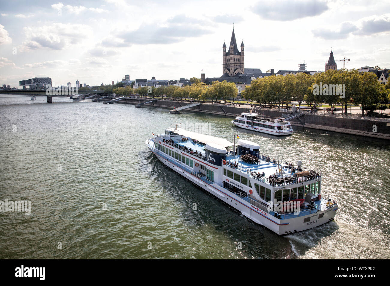 the river Rhine and the old part of the town with the romanesque church Gross St. Martin, far left the Crane Houses in the Rheinau harbor, excursion b Stock Photo