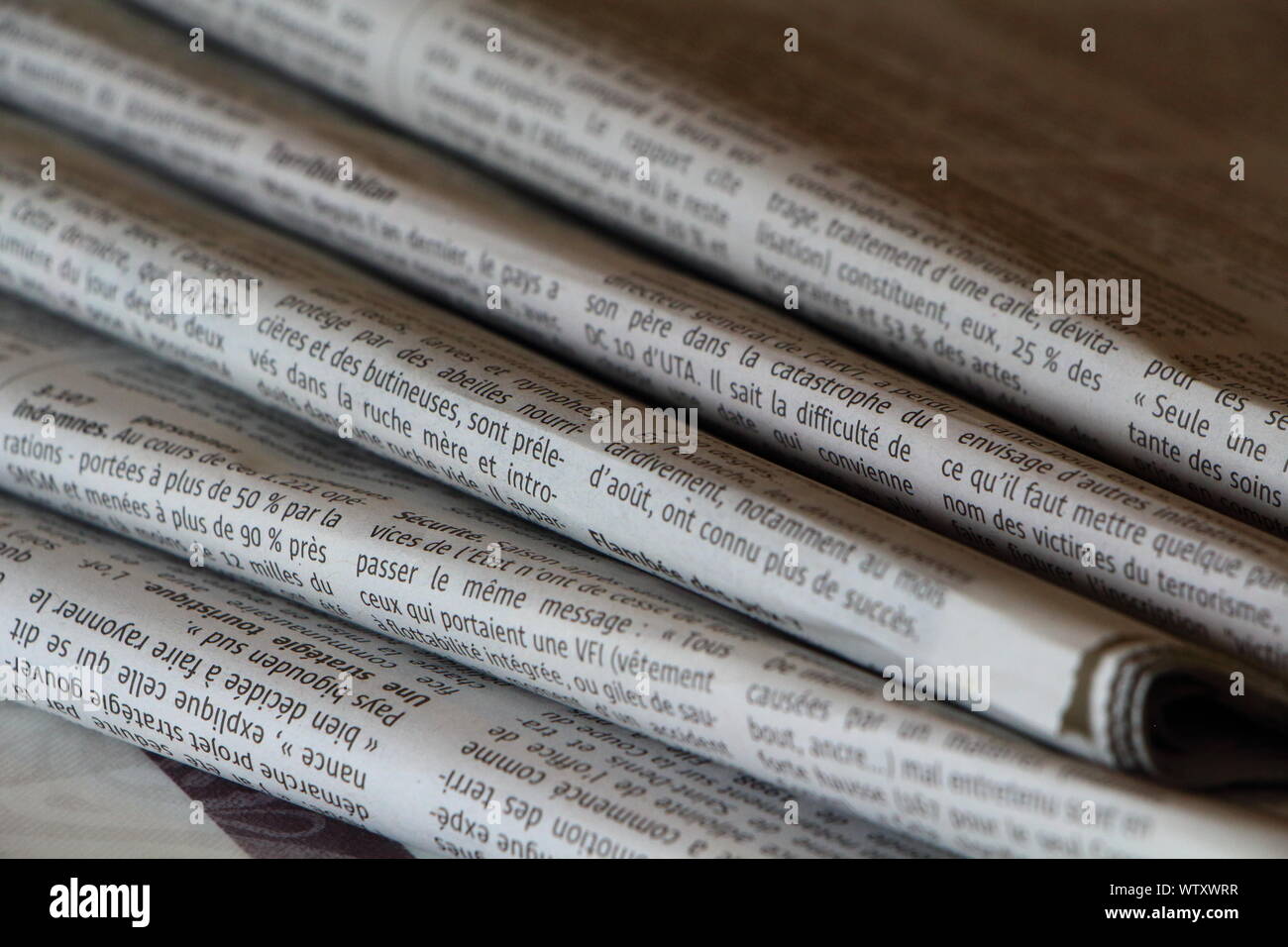 PRIMELIN, FRANCE - SEPTEMBER 24 : Pile of french newspapers on a table, September 24, 2016 Stock Photo