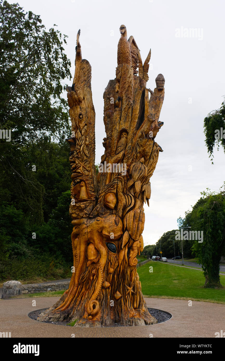 A large wooden sculpture (Tree of Life) created from a dead tree outside  the corner of St Anne's Park, near Bull Island, Raheny, Ireland Stock Photo  - Alamy