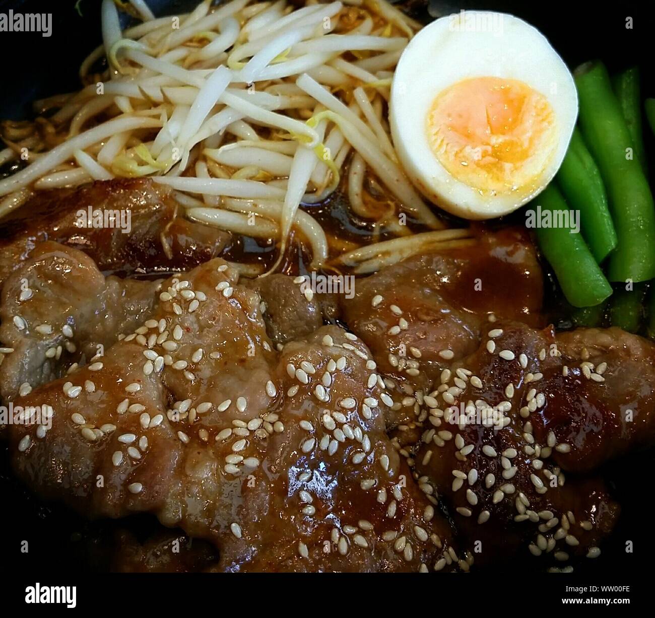 Close-up Of Grilled Pork With Boiled Egg And Bean Sprout Stock Photo