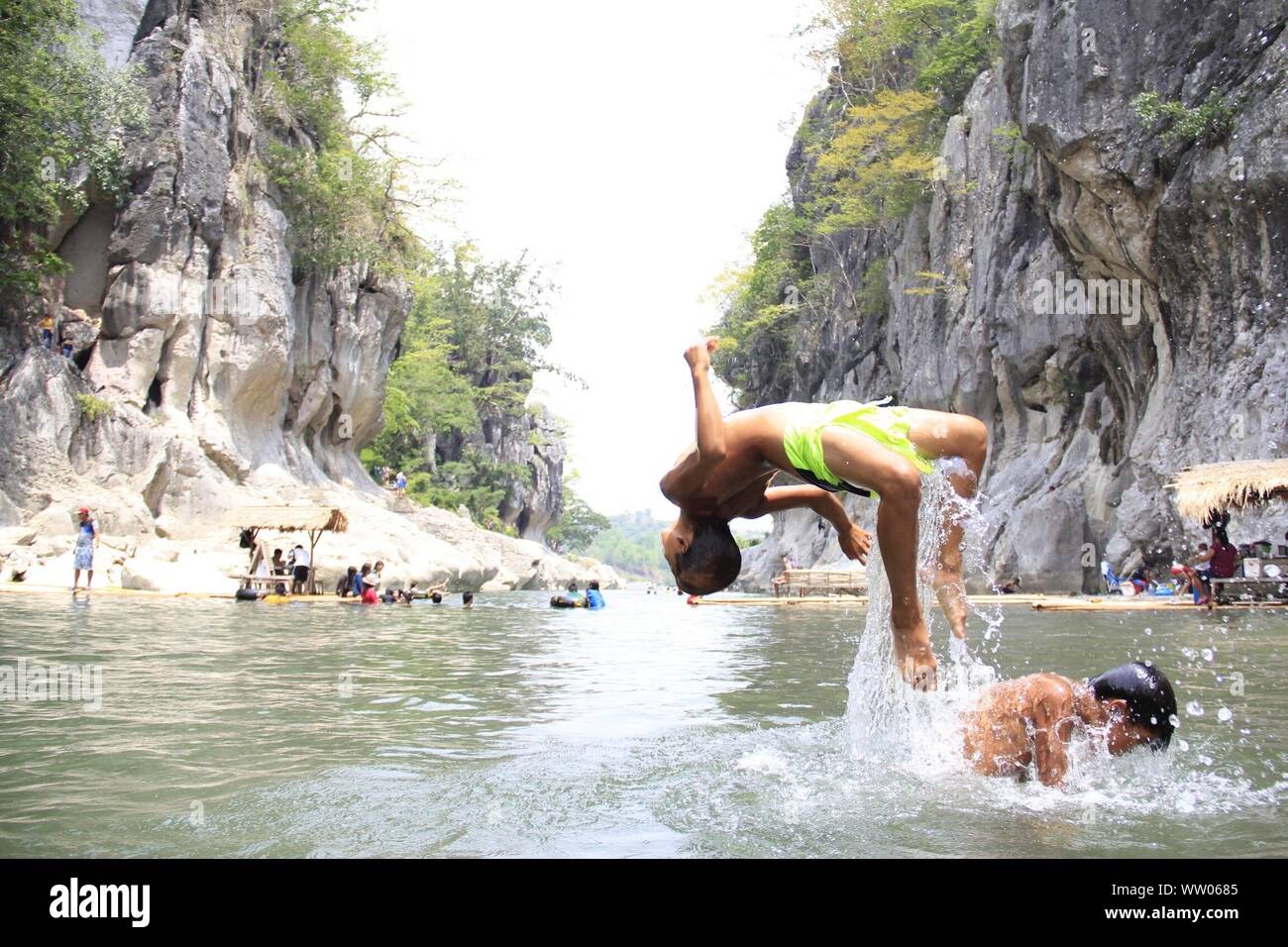 Boys jumping tree river hi-res stock photography and images - Alamy