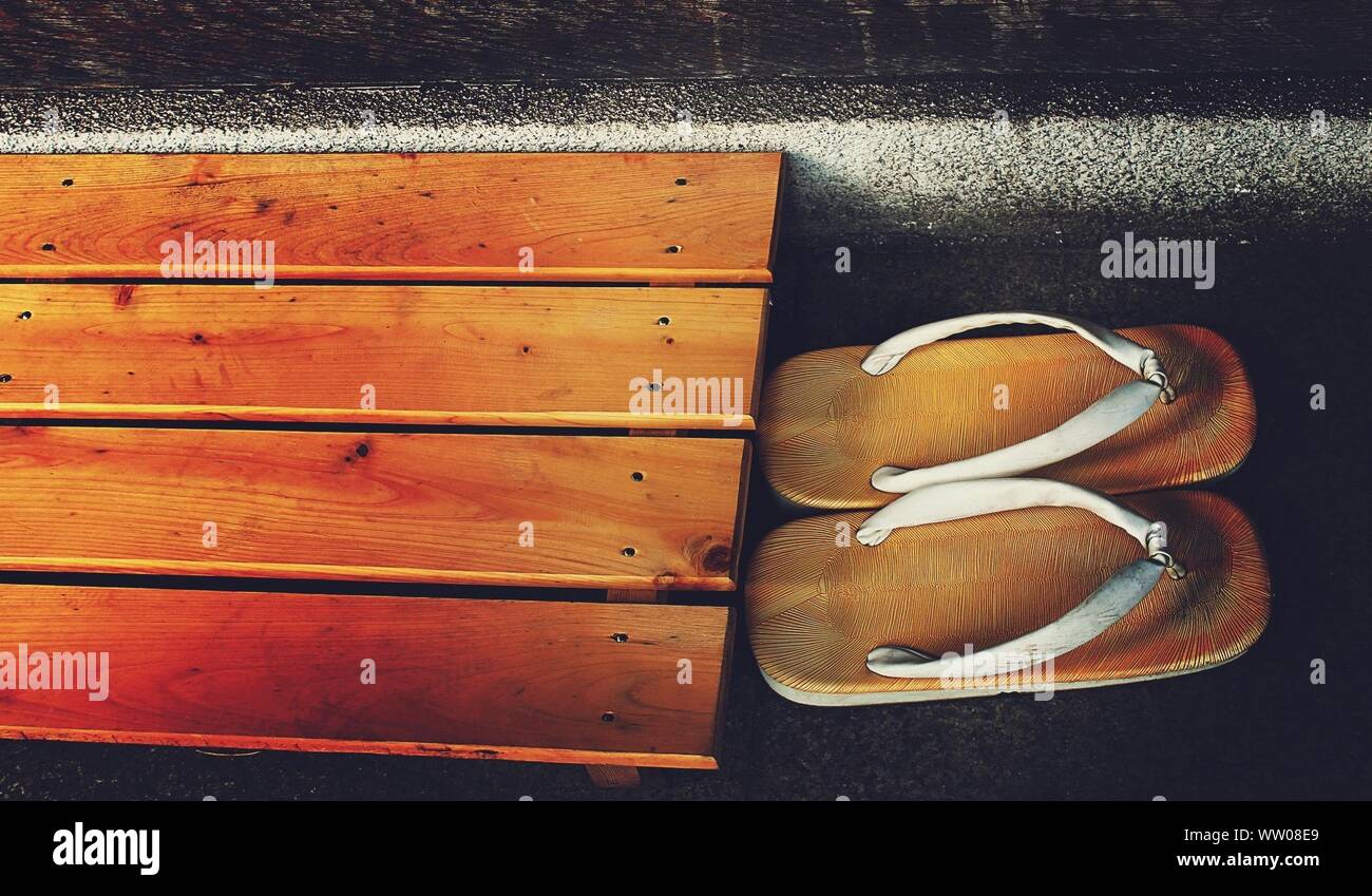 High Angle View Of Flip Flop By Bench Stock Photo 273528593 Alamy