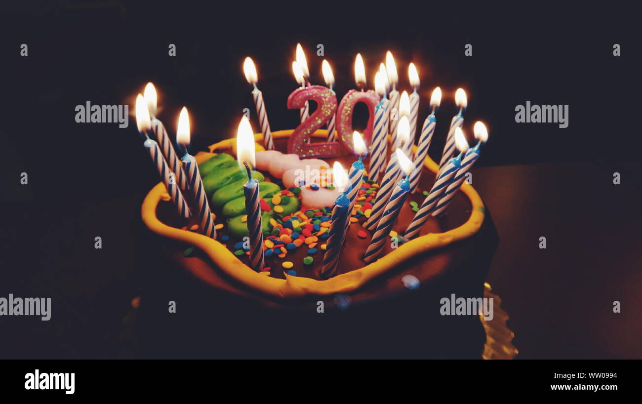 Close-up Of Lite Candles On Birthday Cake Stock Photo