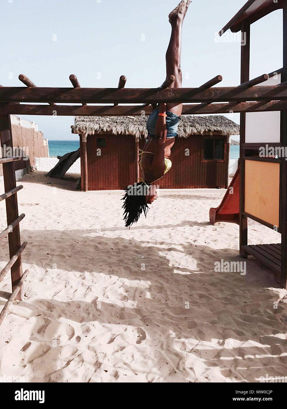 Young women hanging upside down hi-res stock photography and images - Alamy
