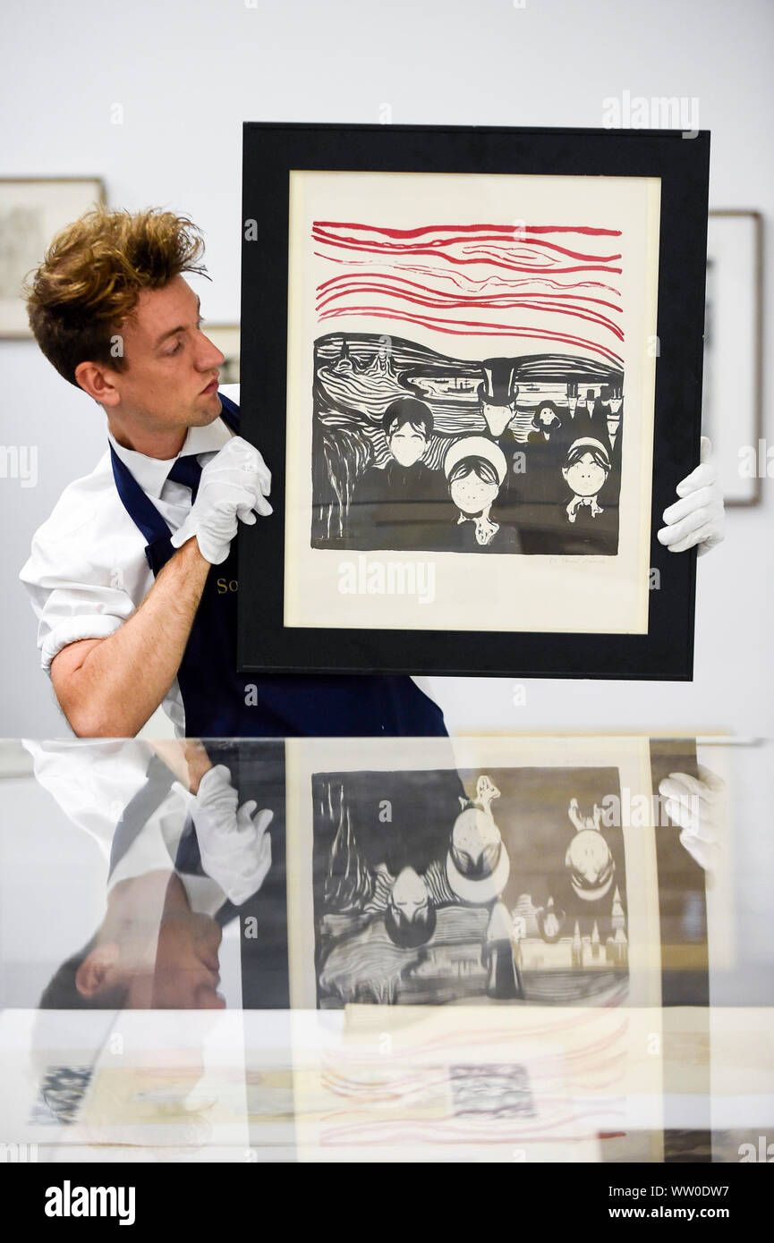 London, UK.  12 September 2019.  A technician presents a lithograph 'Le Soir' (Angst) by Edvard Munch at a photocall for 'Les Peintres-Graveurs', a multi-artist portfolio of lithographs published in 1896 by Ambroise Vollard, to be auctioned at Sotheby's on September 17 with an estimate of £500,000 to £1,000,000.  It is the only known complete example and includes 22 prints by the greatest Impressionist and Post-Impressionist artists., as well as the first colour lithograph by, a then not so well-known, Edvard Munch. Credit: Stephen Chung / Alamy Live News Stock Photo