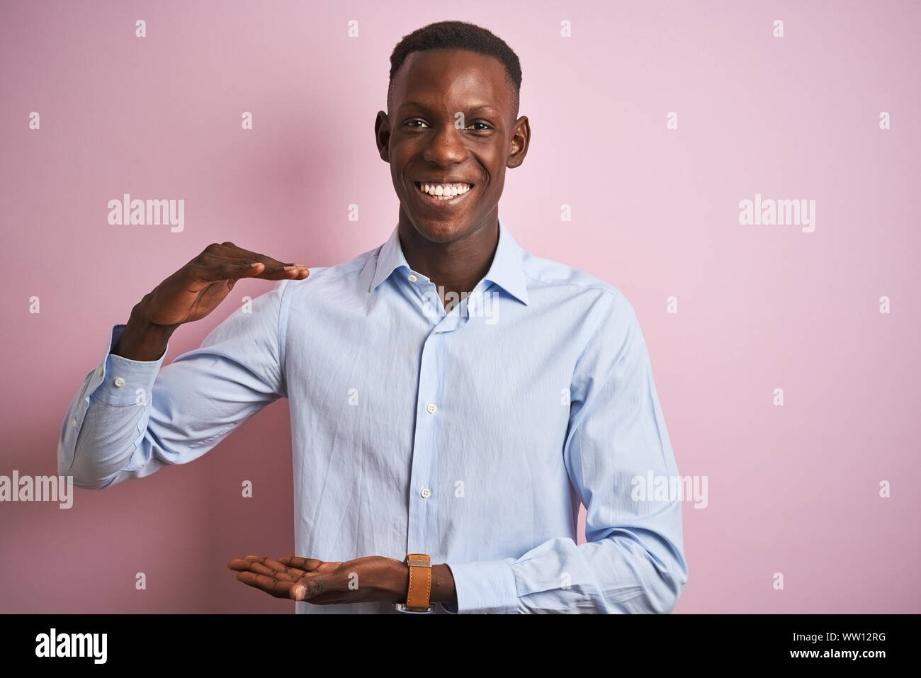 African american man wearing blue elegant shirt standing over isolated ...