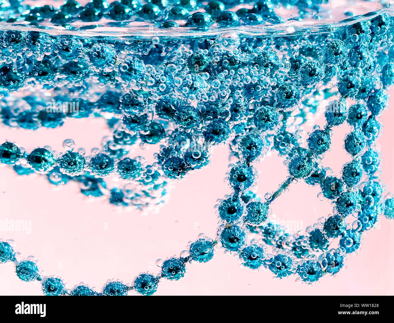 Blue beads in water with bubbles, Christmas card, abstraction Stock