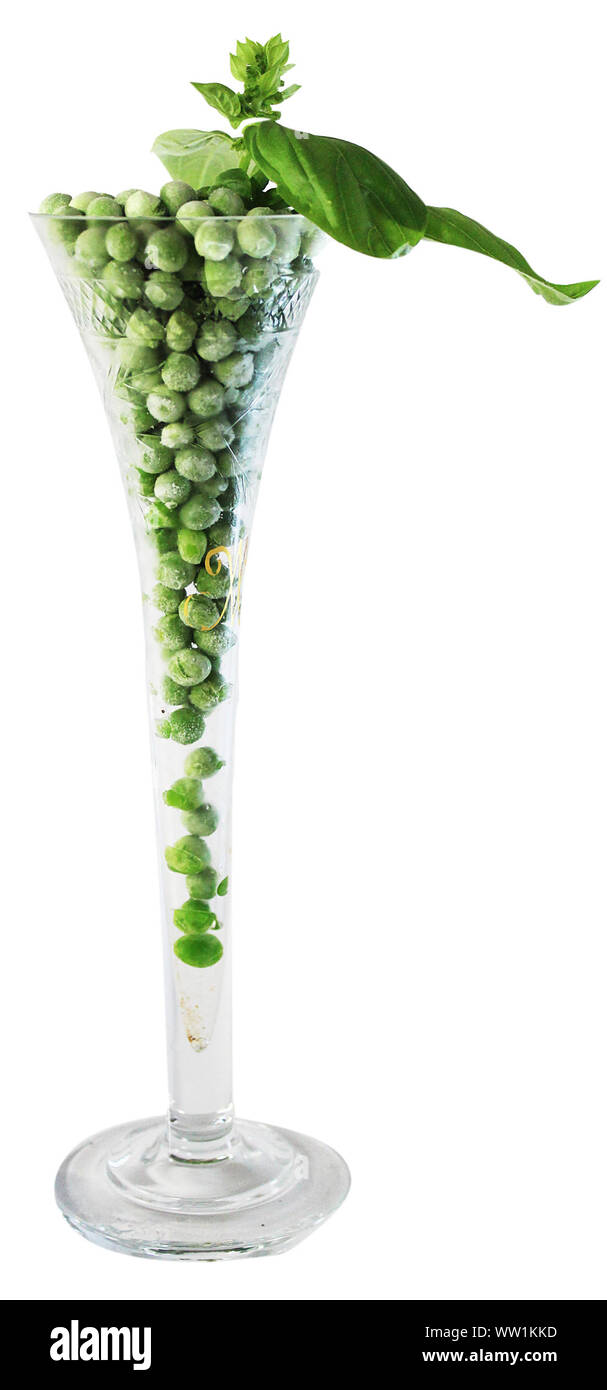 Close-up Of Fresh Peas In Glass Against White Background Stock Photo